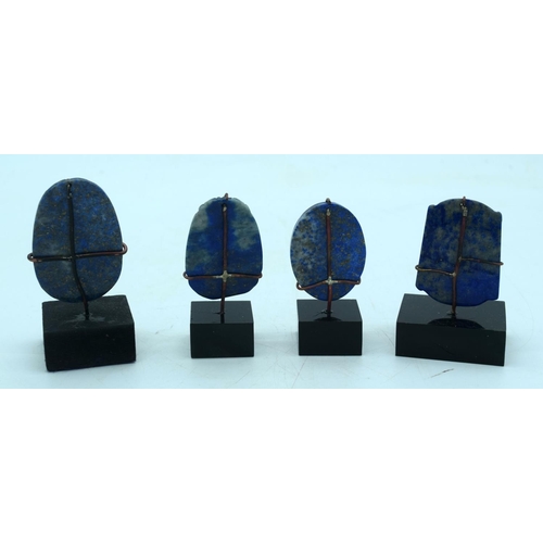 2650 - A collection of carved Lapis Lazuli boulders on stands 6cm .