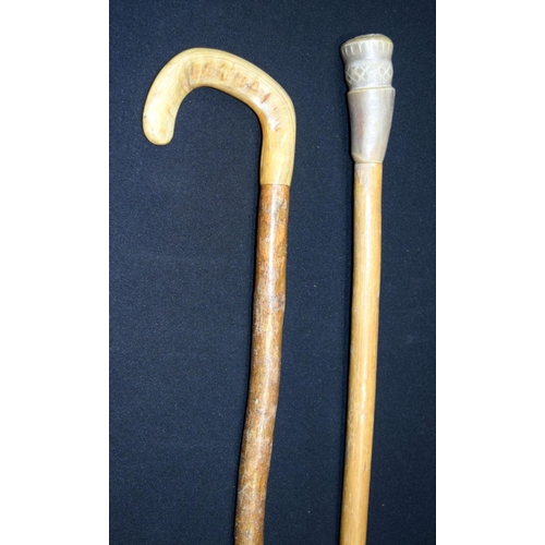 2651 - A carved Rhino horn handled walking stick together with another possibly Rhino horn. 92cm (2)