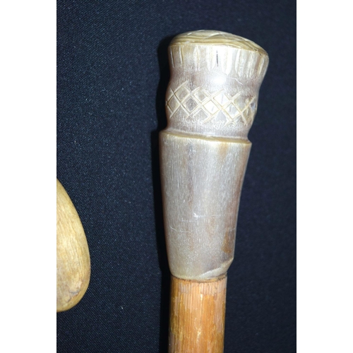 2651 - A carved Rhino horn handled walking stick together with another possibly Rhino horn. 92cm (2)