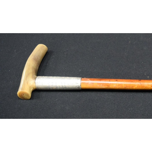 2652 - A Rhino horn handled walking stick with fine silver banding 92cm