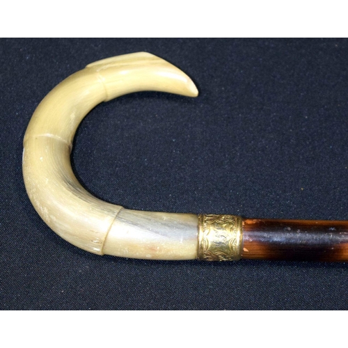 2653 - A Buffalo horn handled cane walking stick with gilded banding 94cm