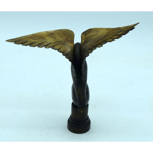 2655 - A  carved horn bird mounted on a wooden plinth .24cm .