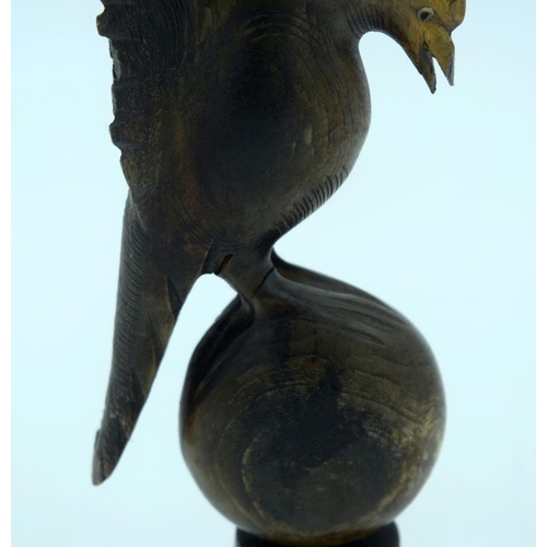 2655 - A  carved horn bird mounted on a wooden plinth .24cm .