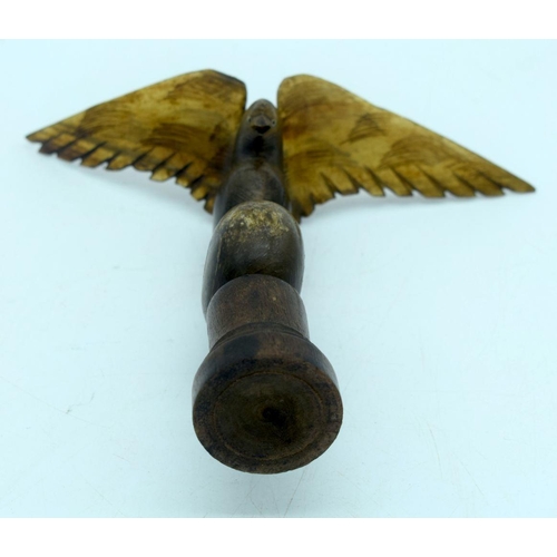 2655 - A  carved horn bird mounted on a wooden plinth .24cm .