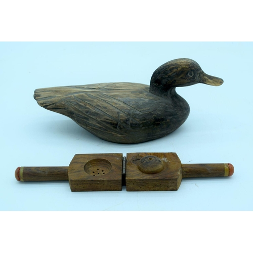 2661 - A vintage hand carved wooden decoy and a fruit press. 29cm (2).