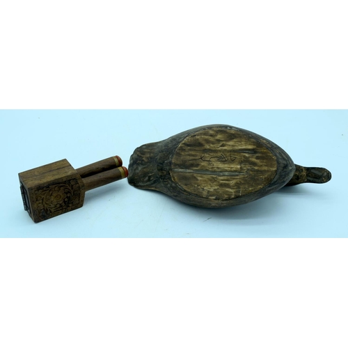 2661 - A vintage hand carved wooden decoy and a fruit press. 29cm (2).