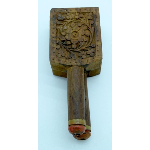 2661 - A vintage hand carved wooden decoy and a fruit press. 29cm (2).