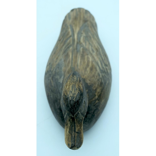 2661 - A vintage hand carved wooden decoy and a fruit press. 29cm (2).