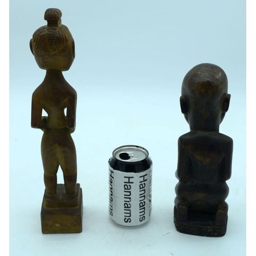 2663 - A carved wooden African  kneeling fertility  figure and another figure . 33 cm (2).