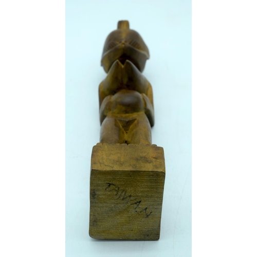 2663 - A carved wooden African  kneeling fertility  figure and another figure . 33 cm (2).