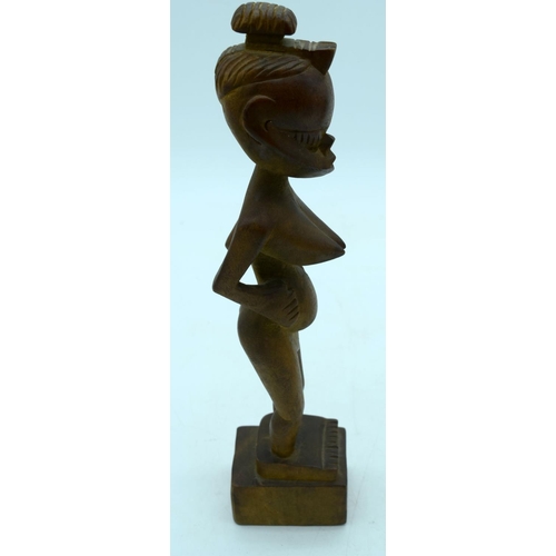 2663 - A carved wooden African  kneeling fertility  figure and another figure . 33 cm (2).