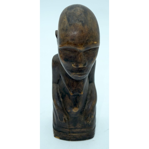 2663 - A carved wooden African  kneeling fertility  figure and another figure . 33 cm (2).