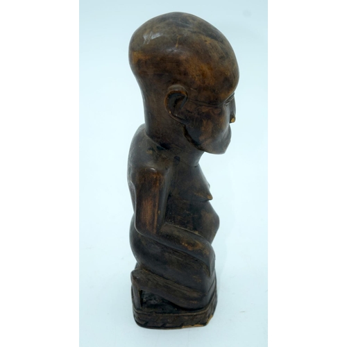 2663 - A carved wooden African  kneeling fertility  figure and another figure . 33 cm (2).