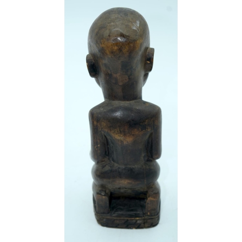 2663 - A carved wooden African  kneeling fertility  figure and another figure . 33 cm (2).