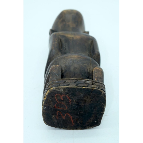 2663 - A carved wooden African  kneeling fertility  figure and another figure . 33 cm (2).