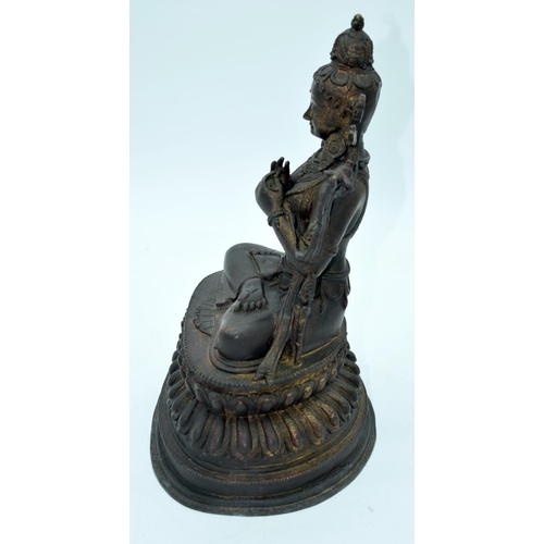 2667 - A large Chinese/Tibetan bronze buddha 35 x 25cm.