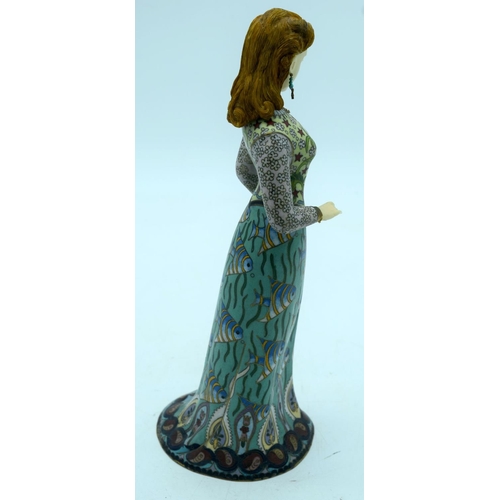 2672 - An unusual enamelled metal figure of a European figure of a female 32cm