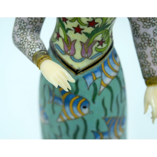 2672 - An unusual enamelled metal figure of a European figure of a female 32cm