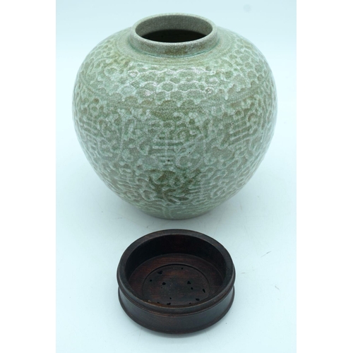 2677 - A Chinese Celadon glazed ginger jar with a hardwood cover 24cm (2)