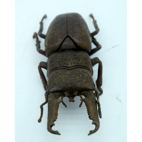 2682 - A Japanese bronze figure of a stag beetle 14 cm.