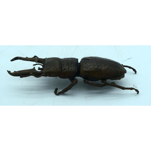 2682 - A Japanese bronze figure of a stag beetle 14 cm.