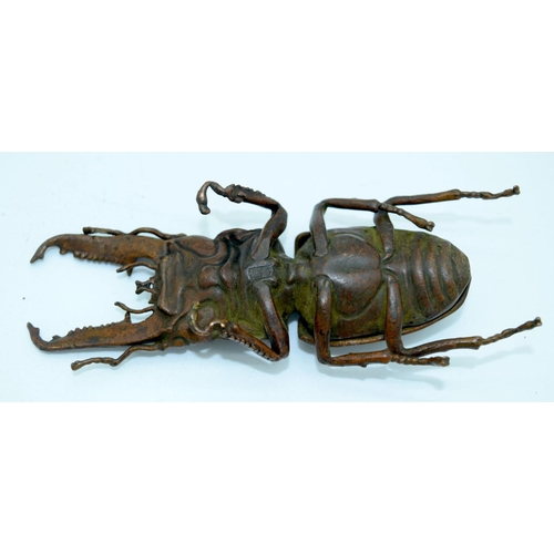 2682 - A Japanese bronze figure of a stag beetle 14 cm.