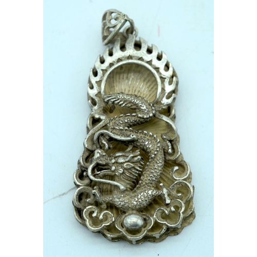 2696 - Two Chinese white metal pendants with a dragon and a warrior. 7Cm (2)