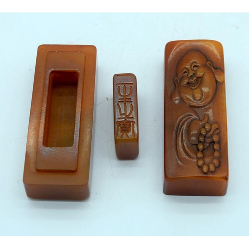 2697 - A Chinese Soapstone seal contained within a carved box 8cm.