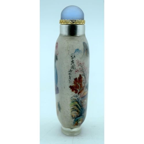 2698 - A Chinese glass snuff bottle reverse painted with a landscape scene  10cm.