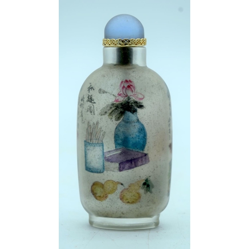 2698 - A Chinese glass snuff bottle reverse painted with a landscape scene  10cm.