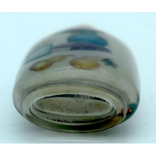 2698 - A Chinese glass snuff bottle reverse painted with a landscape scene  10cm.