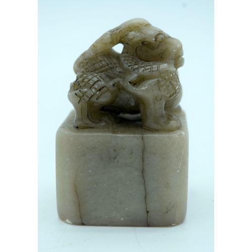 2699 - A carved hard stone seal in the form of a beast 8cm.