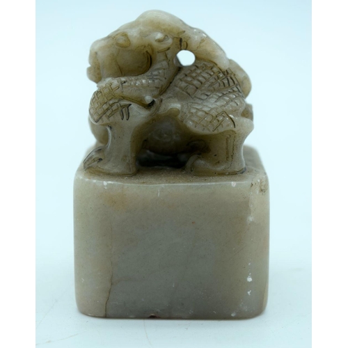 2699 - A carved hard stone seal in the form of a beast 8cm.