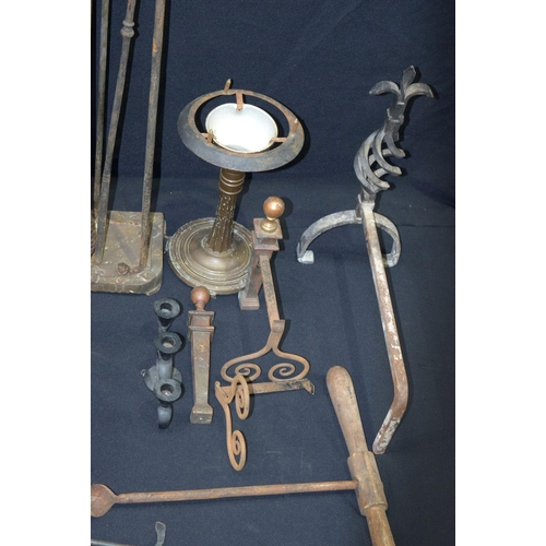 2704 - collection of metal items , hose ends, lamp stands, fire irons/dogs, sword  etc .(Qty)