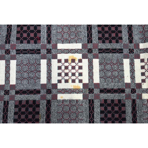 2717 - A large double sided Welsh blanket 230 x 220cm.