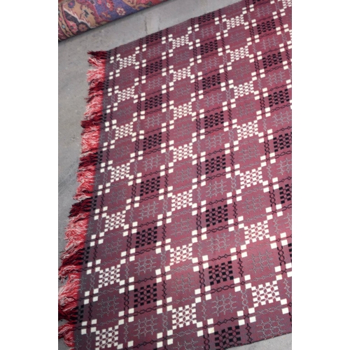 2717 - A large double sided Welsh blanket 230 x 220cm.