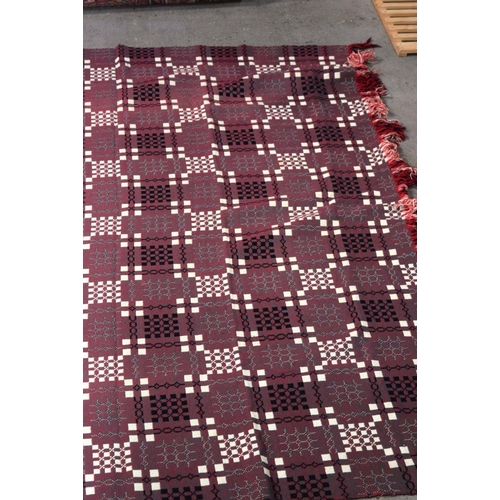 2717 - A large double sided Welsh blanket 230 x 220cm.