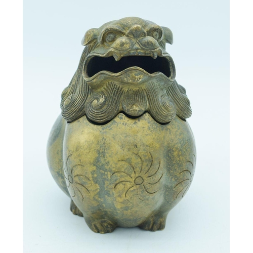 2758 - A Chinese bronze lidded censer in the form of a beast 17 x 17cm (2).