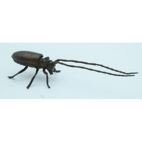 2765 - A Japanese bronze figure of a beetle with antennae  14cm.