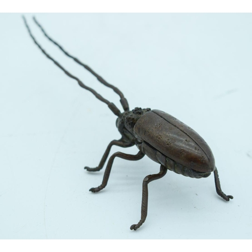 2765 - A Japanese bronze figure of a beetle with antennae  14cm.