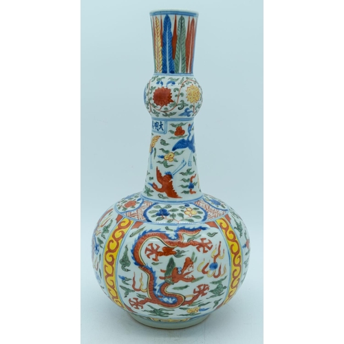 2784 - A Chinese Wucai vase decorated with dragons and birds 38cm .