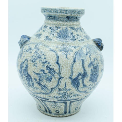 2785 - A Chinese Crackle glaze vase with lions head handles decorated with figures and foliage 27cm