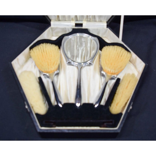 2793 - A lovely silver plate enamelled cased dressing table set largest 26cm.