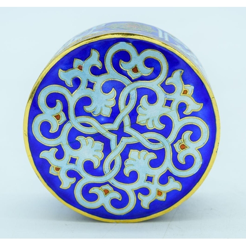 2797 - A small enamelled metal Islamic lidded box 8 x 4cm.