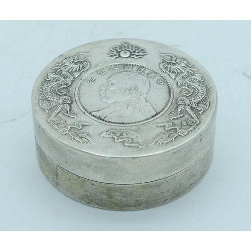 2798 - A Chinese small white metal coin  box embossed with dragons 7.5 cm.