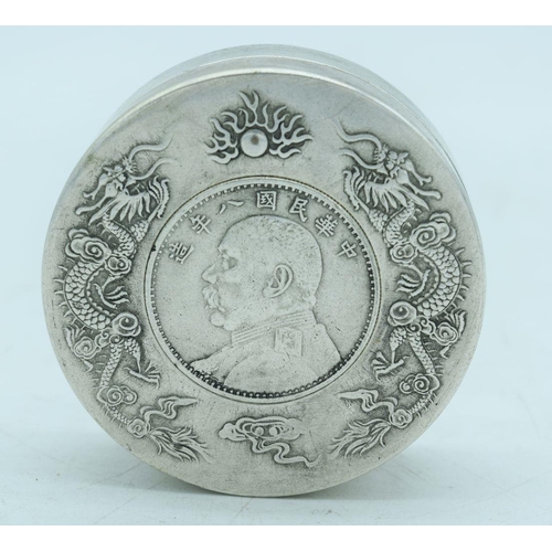 2798 - A Chinese small white metal coin  box embossed with dragons 7.5 cm.