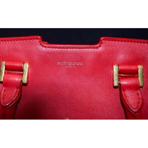 2803 - A Saint Laurent leather handbag together with a Longchamp bag (2).