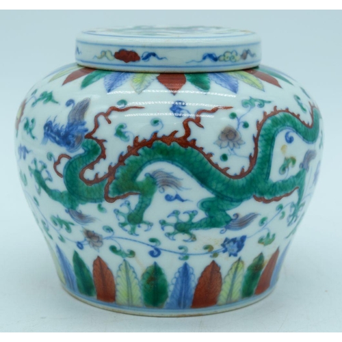 2814 - A Chinese Doucai ginger jar and cover decorated with dragons .