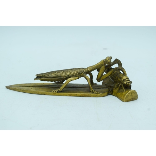 2819 - A small bronze of a locust consuming a beetle 19cm .