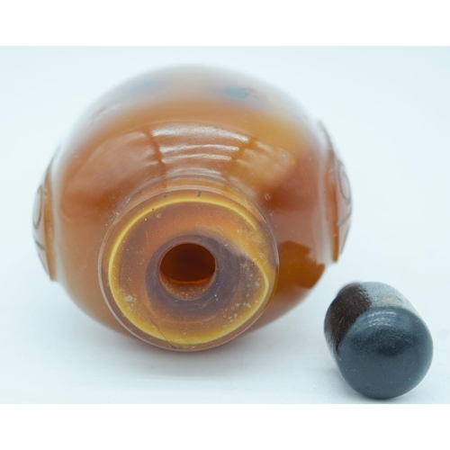 2823 - An carved agate snuff bottle with stopper 9cm.